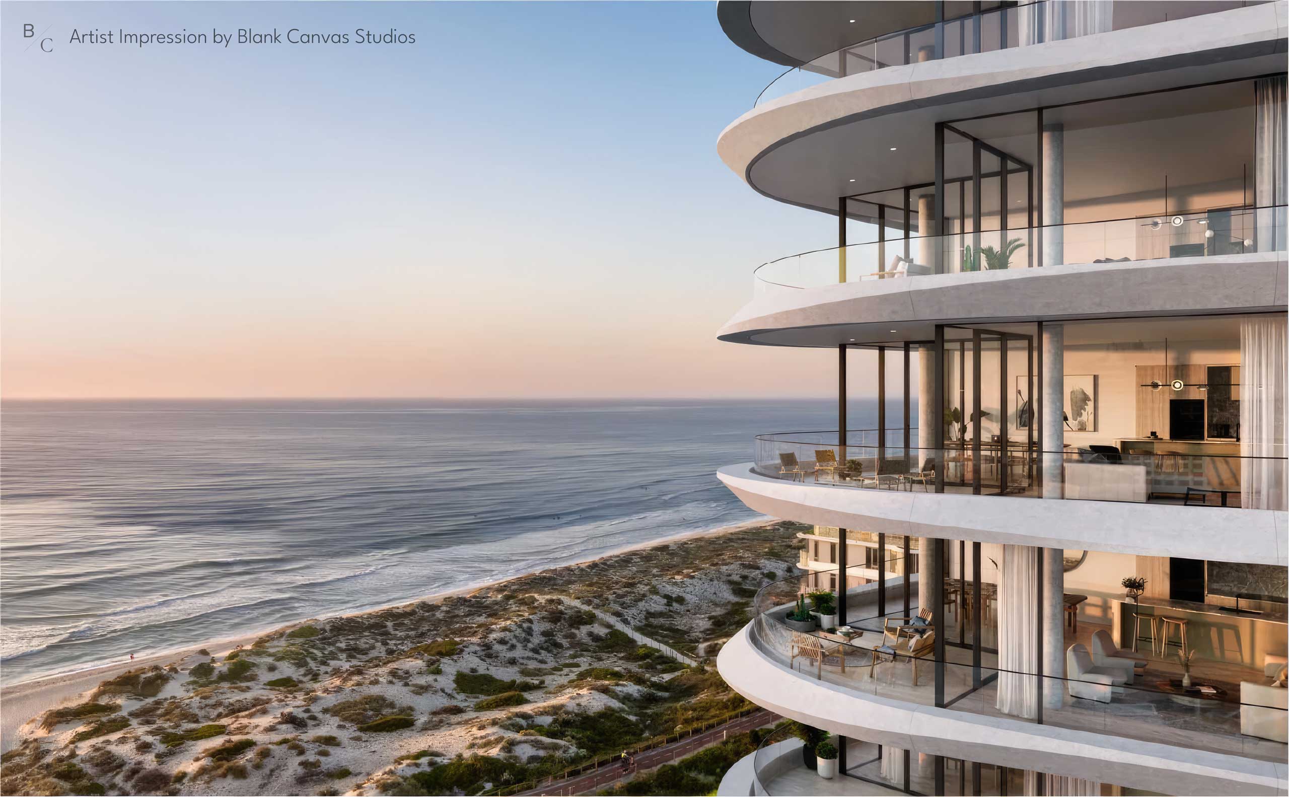 drone shot of a highrise apartment building by the beach